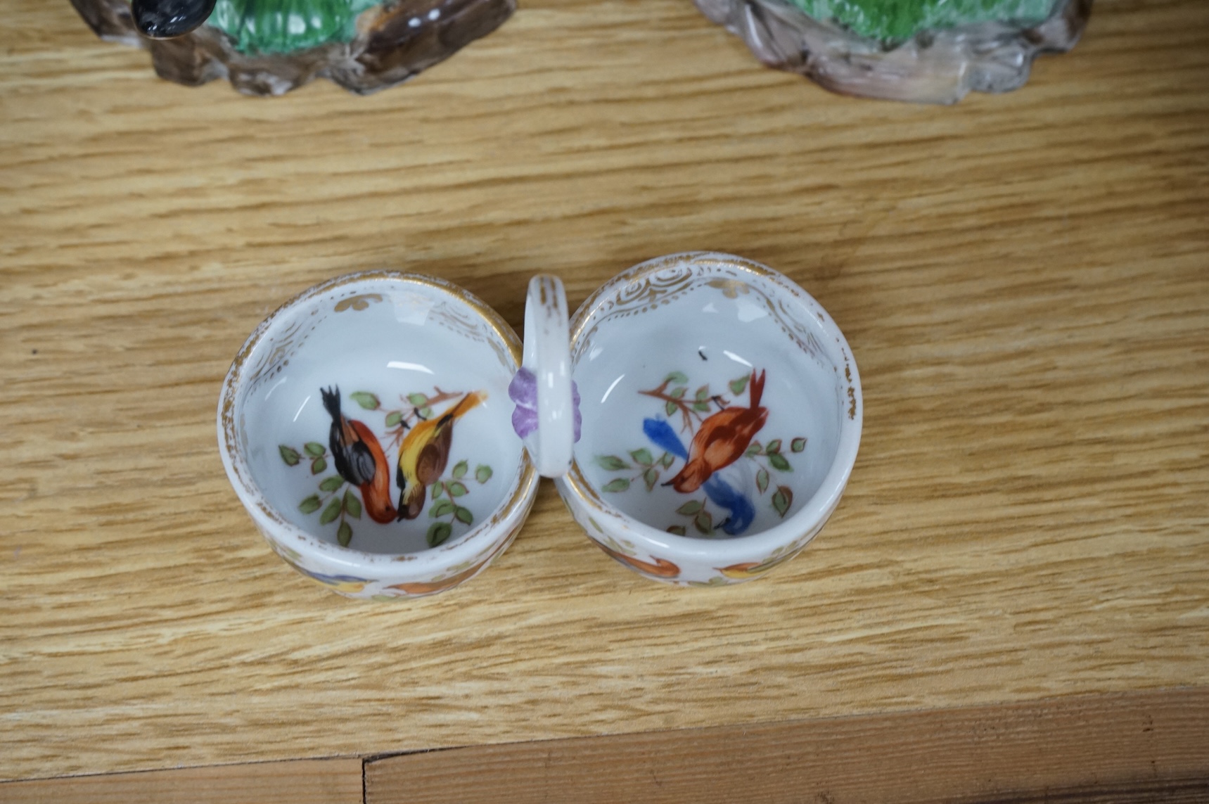 A pair of 19th century Hochst Damm faience figures and a Meissen twin section salt, tallest figure 20cm